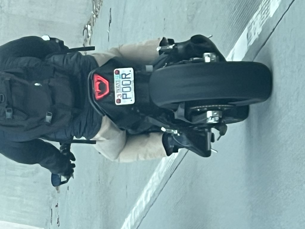 License plate: POOR.